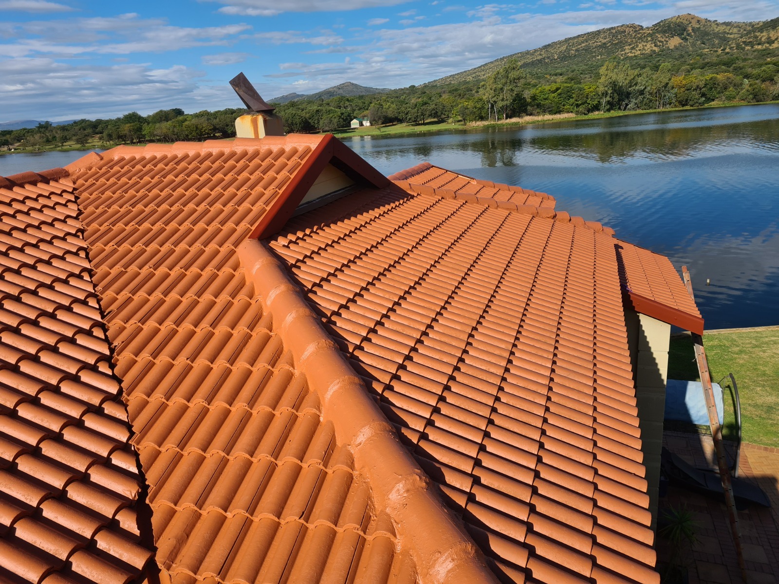 Restored terracotta tiles at lakeside home